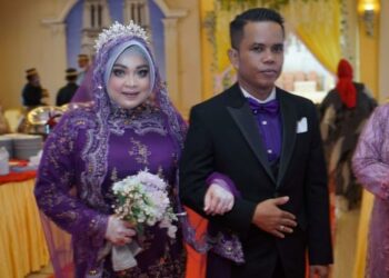PASANGAN pengantin itu melangsungkan majlis perkahwinan di Makassar, Sulawesi Selatan. -KOMPAS.COM 