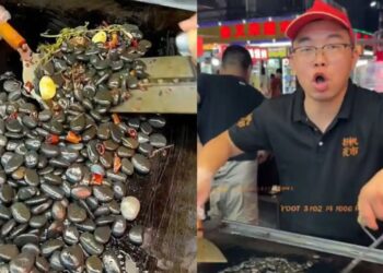 RAKAMAN video menunjukkan lelaki menjual hidangan batu kerikil tumis di wilayah Hunan, China. - AGENSI