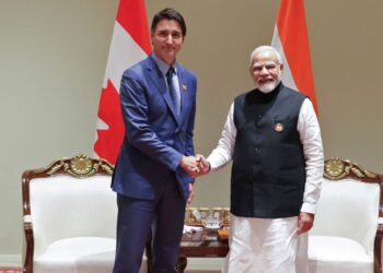 PERDANA Menteri Kanada, Justin Trudeau bersalaman dengan Perdana Menteri India, Narendra Modi ketika Sidang Kemuncak G20 di New Delhi, baru-baru ini. - AFP