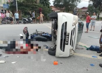 KEADAAN kereta yang terlibat kemalangan dengan sebuah motosikal menyebabkan seorang maut di Kampung Changkat Kinding, di Ipoh hari ini. - UTUSAN