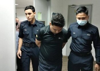 MUHAMMAD Aiman Danial Mohd. Najib (tengah) dijatuhi hukuman denda RM7,000 oleh Mahkamah Majistret Ipoh hari ini selepas mengaku bersalah mencabul pelancong warga Sepanyol dan memiliki video lucah, minggu lalu. - UTUSAN