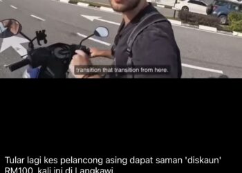 TANGKAP layar video tular mendakwa seorang anggota polis mengambil bayaran daripada seorang pelancong asing kerana tidak memakai topi keledar di Langkawi.