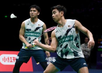 Goh Sze Fei-Nur Izzuddin  tinggalkan BAM awal bulan depan.-AFP