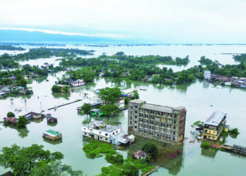 An aerial view shows flooded area in Companiganj of Sylhet district on June 20, 2024. In Sylhet, lashing rain and rivers swollen by flooding upstream in India also swamped heavily populated areas. (Photo by Munir UZ ZAMAN / AFP)