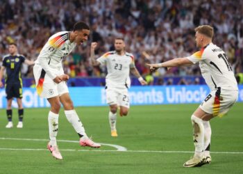 JAMAL Musiala (kiri) meraikan jaringan gol kedua Jerman dalam aksi menentang Scotland di Stadium Allianz Arena,