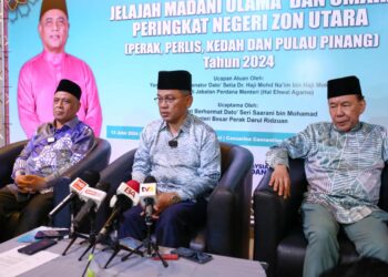 MOHD. Na'im Mokhtar (tengah) pada sidang akhbar di Majlis Jelajah Madani Ulama dan Umara Peringkat Negeri Zon Utara di Ipoh hari ini. - UTUSAN/MUHAMAD NAZREEN SYAH MUSTHAFA