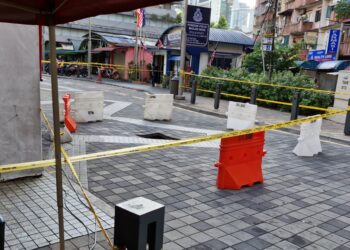 SATU lagi tanah mendap dikesan  berhampiran lokasi tanah jerlus di Masjid India, Kuala Lumpur ekoran hujan lebat.