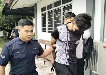 MUHAMMAD Shahril Muhamad Radzuan (tengah) dijatuhi hukuman penjara sehari dan denda RM2,000 oleh Mahkamah Majistret Parit Buntar atas pertuduhan membuat laporan palsu berkaitan penemuan bayi perempuan, dua minggu lalu. - UTUSAN