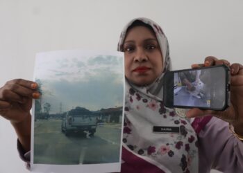 DR. Saira Banu Mohamed Rejab menunjukkan gambar kucing yang tergantung di bahagian belakang sebuah kenderaan dan gambar terkini haiwan itu (kanan) selepas menerima rawatan di JPV Pulau Pinang.-UTUSAN/IQBAL HAMDAN