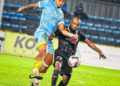 RODRIGO Dias (kiri) cuba melepasi kawalan pemain PDRM FC, Fadi Mahmoud Awad Saleh dalam aksi Liga Super di Stadium Bandaraya, Pulau Pinang malam ini.-GAMBAR/PDRM FC