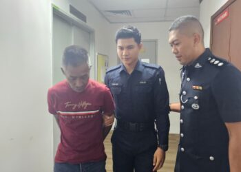 MOHD. Saffuan Nor Rahim (kiri) didakwa mengedar dadah jenis heroin seberat 19.2kg di Mahkamah Majistret Ipoh hari ini. - UTUSAN