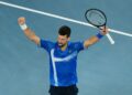 Novak Djokovic meraikan kejayaannya menewaskan Carloz Alcaraz pada Terbuka Australia malam tadi. - AFP