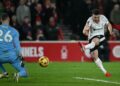 Pemain Liverpool, Diogo Jota merembat bola ke gawang Nottingham Forest dalam saingan Liga Perdana Inggeris di The City Ground. - AFP