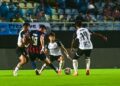 PEMAIN Terengganu FC (TFC) mengawal pergerakan penyerang Johor Darul Ta'zim (JDT), Romel Moralez (jersi nombor 19)  dalam aksi separuh akhir pertama Piala Malaysia di Stadium Sultan Mizan Zainal Abidin, Kuala Nerus, malam ini. - UTUSAN/PUQTRA HAIRRY