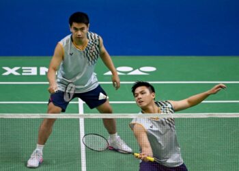 Nur Izzuddin Mohd Rumsani-Goh Sze Fei kandas di pusingan kedua All England 2025.-AFP