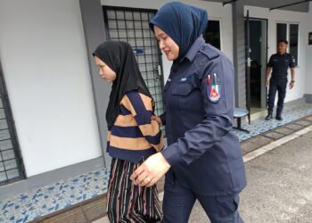 NURUL Ain Haslan yang dituduh membunuh bayi dibawa ke Mahkamah Majistret Port Dickson, Negeri Sembilan, semalam. – UTUSAN/NOR AINNA HAMZAH 