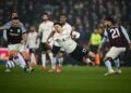 Pemain tengah Liverpool, Curtis Jones (tengah) diasak pemain Aston Villa, Marco Asensio (kanan) dalam aksi Liga Perdana Inggeris di Villa Park, Birmingham, semalam. - AFP