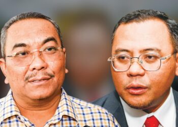 AMIRUDIN Shari (kanan) dan Muhammad Sanusi Md. Nor hadir ke prosiding dekat Mahkamah Tinggi, di Shah Alam, Selangor semalam. - UTUSAN / AFIQ RAZALI