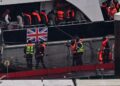 PENDATANG yang ditangkap ketika cuba menyeberangi Selat Inggeris dari Perancis, turun dari kapal Pasukan Sempadan 'Typhoon' selepas tiba di Marina di Dover, tenggara England, kelmarin.- AFP