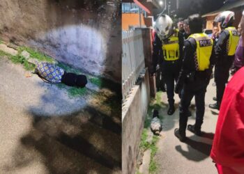 POLIS melakukan pemeriksaan terhadap bungkusan yang mengandungi seikat daun semambu di taman permainan Kampung Durian Daun, Melaka.