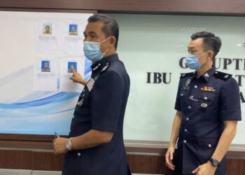 ABD. Khalid Othman menunjukkan gambar suspek dalam sidang akhbar di Ibu Pejabat Polis Daerah Subang Jaya, Selangor, hari ini.