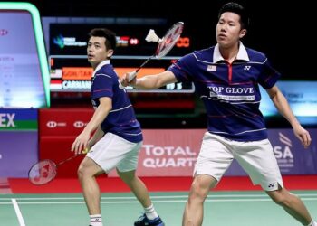 GOH V Shem (kanan) dan Tan Wee Kiong. - AFP