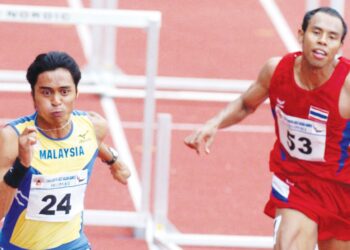 ROBANI Hassan (kiri) ketika memenangi pingat emas 110 meter lari berpagar pada Sukan SEA 2005 di Manila.