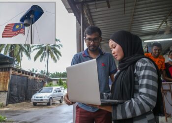 Seorang pelajar, Nor Dalilawati Syahril, 20, menghadapi kesukaran mendapatkan internet bagi sesi pembelajaran beliau dan terpaksa menumpang menggunakan internet di rumah Barathidhasa Verapen, 26 di Ladang UP, Bukit Selambau. - UTUSAN/SHAHIR NOORDIN