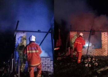 ANGGOTA bomba berusaha memadamkan kebakaran di sebuah rumah di Kampung Kuala Pah, Jelebu malam tadi.