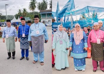 MAS ERMIEYATI Samsudin (kanan) dan Abdul Hakim Abdul Wahid tiba di Pusat Penamaan Calon di Dewan Kompleks Masjid Tanah, Melaka. - UTUSAN/MUHAMMAD SHAHIZAM TAZALI