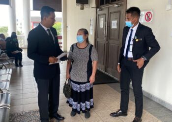 HO YUH MA bersama peguamnya ketika perbicaraan di Mahkamah Sesyen George Town, Pulau Pinang hari ini.