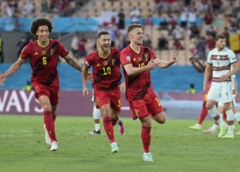 PEMAIN tengah Belgium, Thorgan Hazard (depan) meraikan gol jaringannya ketika menentang Portugal di Stadium La Cartuja, Seville, semalam. - AFP