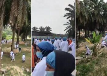 TANGKAP layar video  memaparkan pekerja dipercayai di sebuah kilang dipercayai di Klang, Selangor lari ke dalam ladang sawit untuk mengelak daripada pemeriksaan polis.