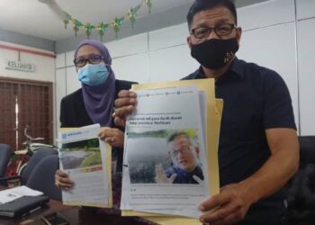 NORHIZAM Hassan Baktee (kanan) dan Faizah Abdul Rahman ketika sidang akhbar berkenaan sebuah syarikat penternakan ikan keli di Kompleks Japerun Pengkalan Baru, Melaka. - UTUSAN/DIYANATUL ATIQAH ZAKARYA